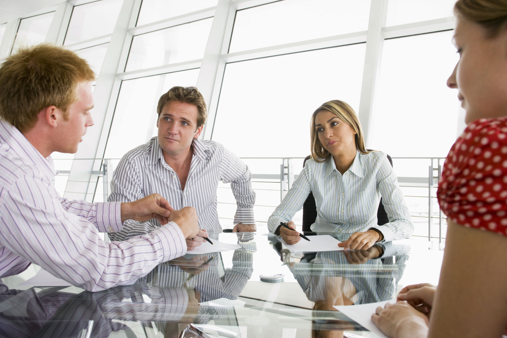 Four businesspeople in a boardroom